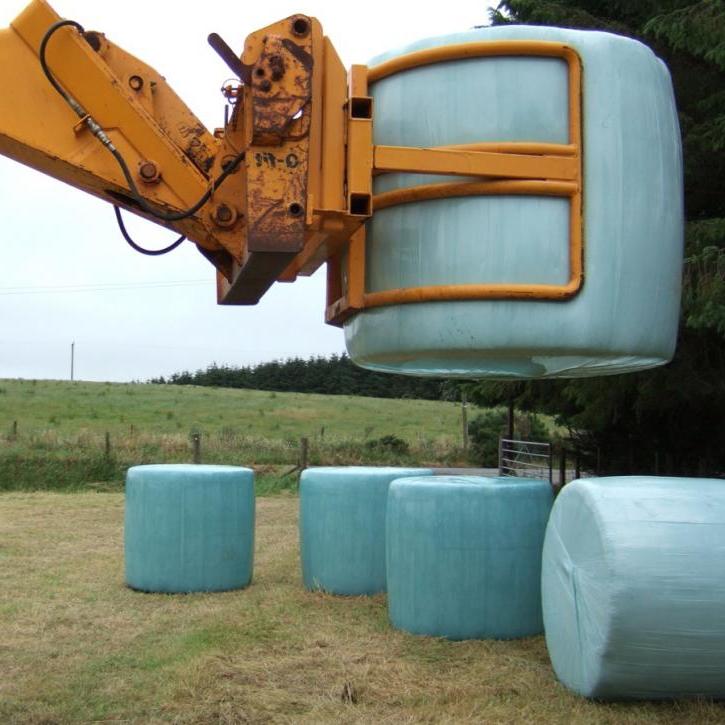 Wrapped Bale Clamp for handing wrapped silage bales.